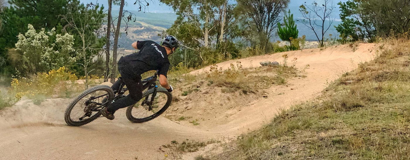 riding teewing electric mountain bike on a dirt trail